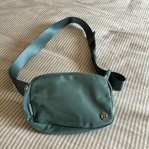 Lululemon cross body bag. Green. Gently used.